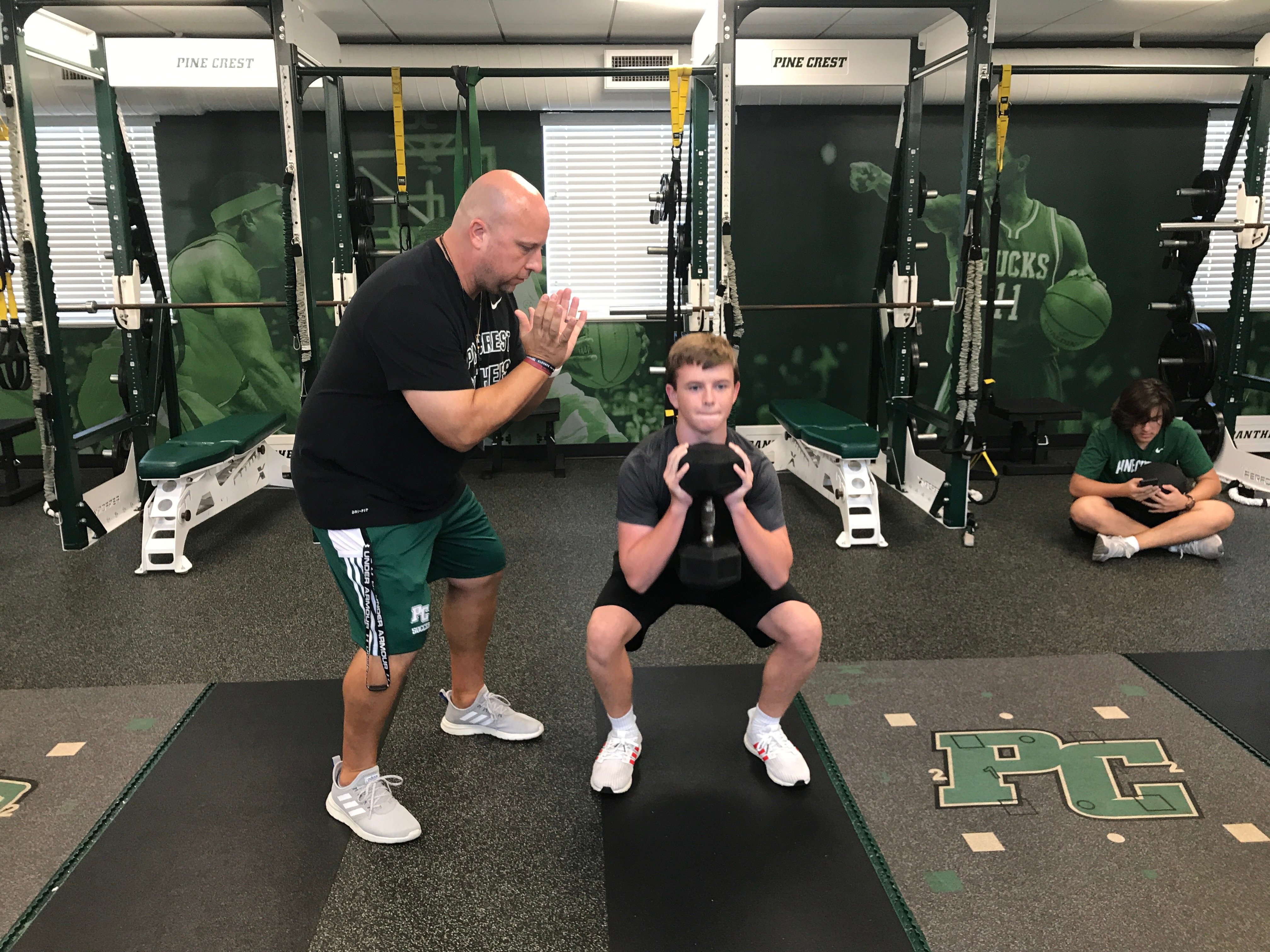 coach and student weightroom